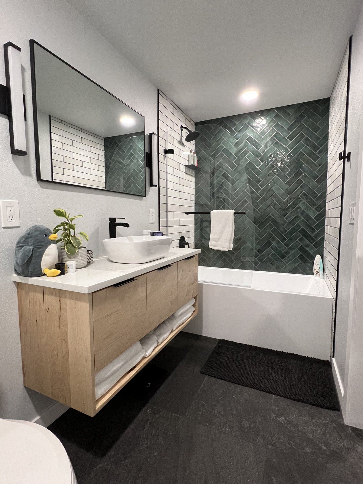 Floating vanity, green herringbone bath
